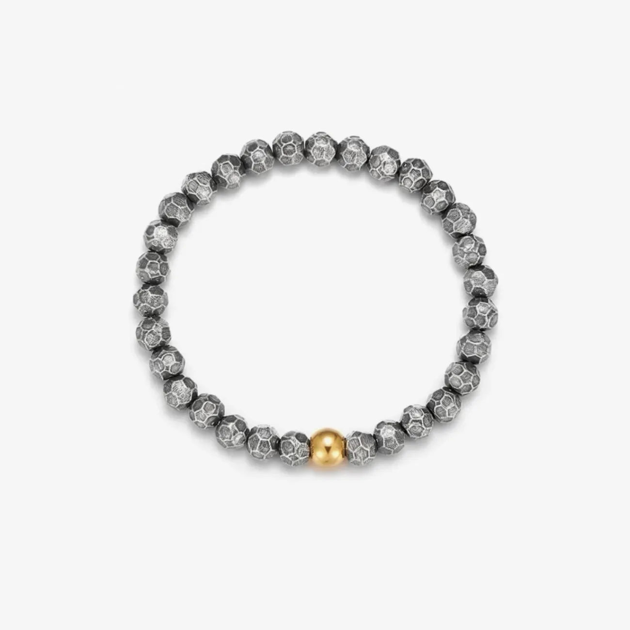Top-down view highlighting the single polished gold bead acting as the visual center of the bracelet