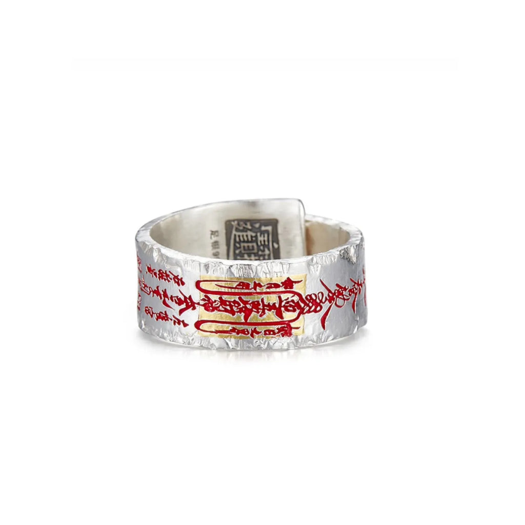 Front view of the 999 fine silver Taoism ring featuring a unique crinkled foil texture and red vermilion script