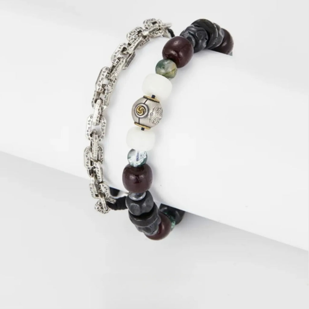 Side detail showing the contrast between translucent Quartz, black Bodhi seeds, and the silver Tomoe charm