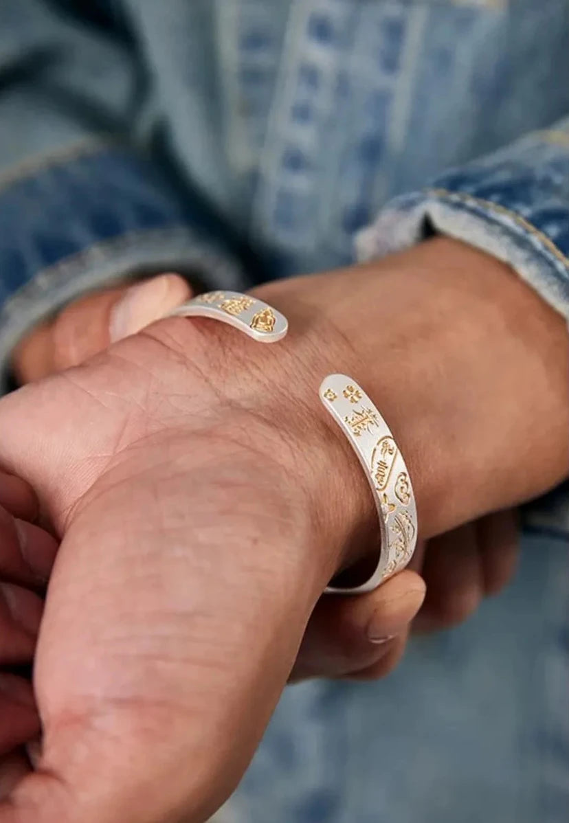 Close-up of the inner wrist showing the open ends of the bangle and the comfortable fit of the silver cuff