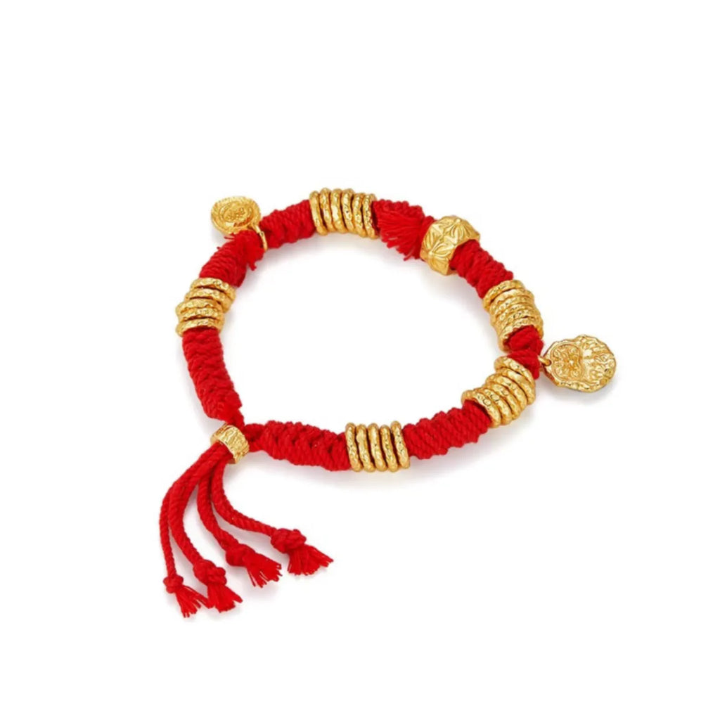 Back view displaying the adjustable sliding knot with decorative red tassels for a traditional touch