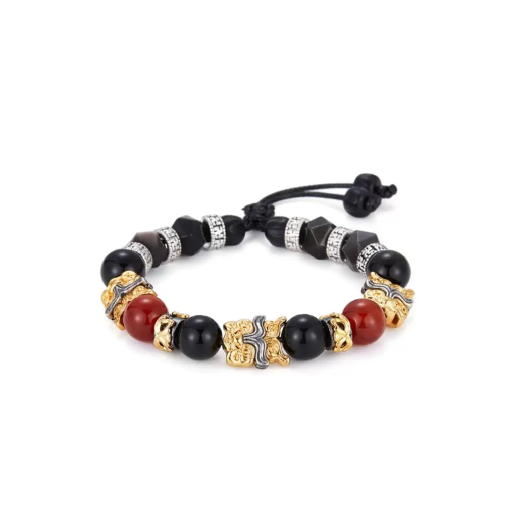 Front view of the Feng Shui bracelet featuring two-tone Pixiu charms, red carnelian, and black agate beads
