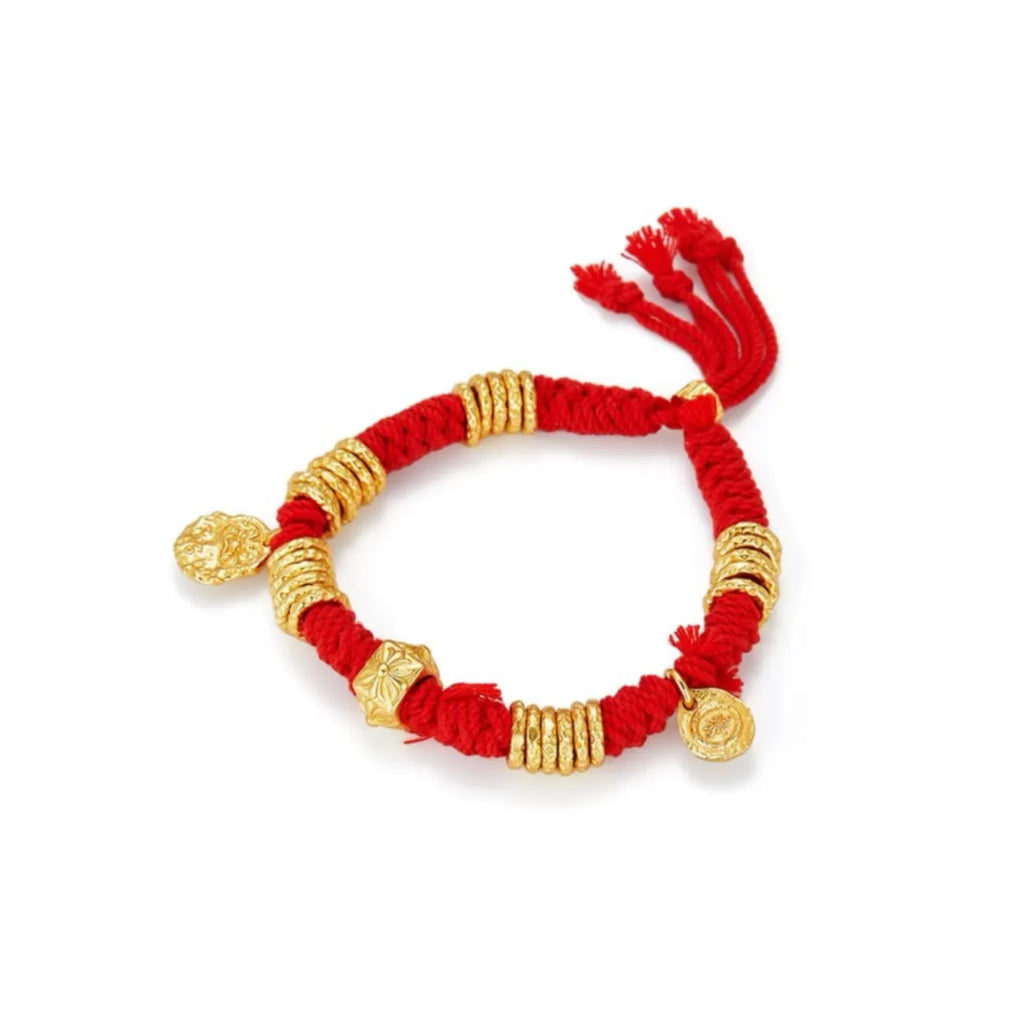 Side profile showing the detailed texture of the "Ancient Gold" finished beads and the soft red rope