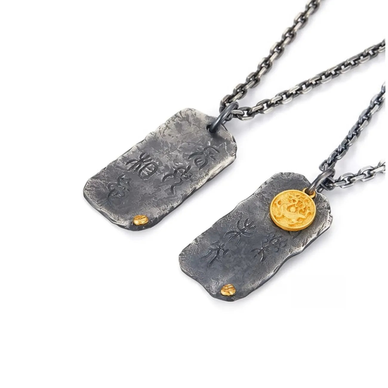 Close-up of the silver tablet pendant engraved with oracle script and inlaid with a golden bronze coin