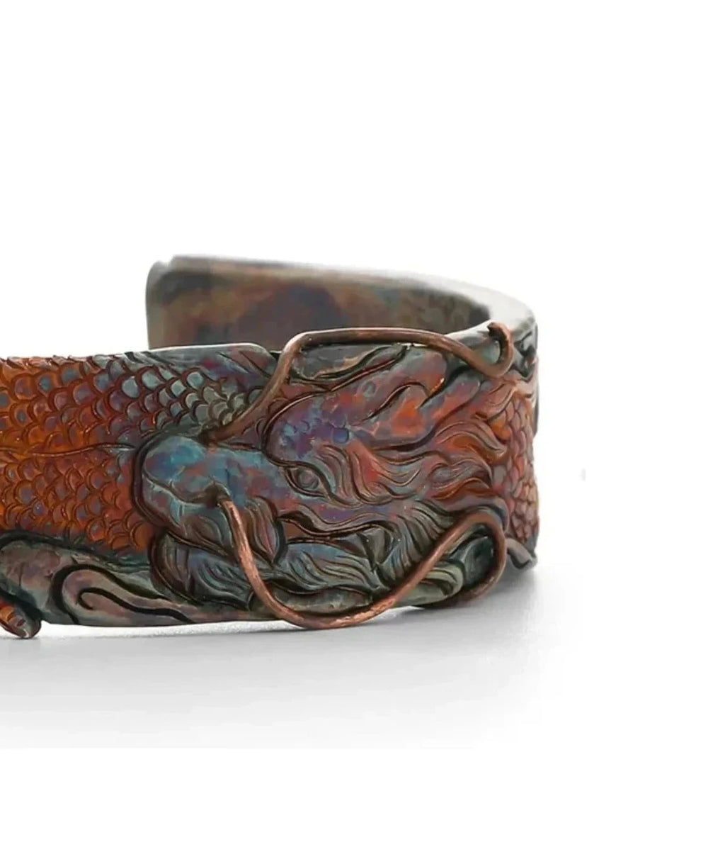 Detailed shot of the dragon's head and claws, showcasing the craftsmanship of the relief sculpture