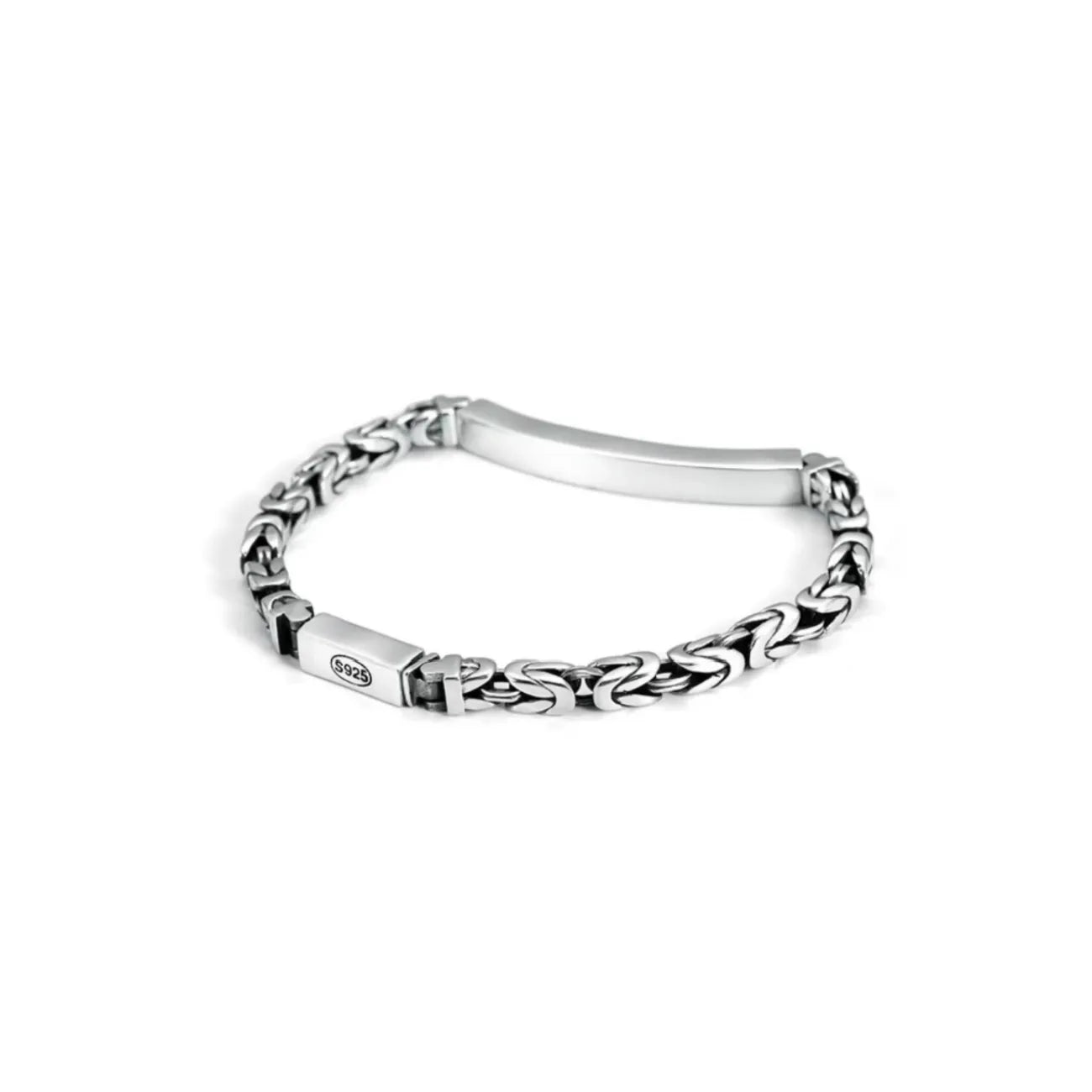 Side profile showing the unique grid-like architectural detailing on the edge of the silver bar