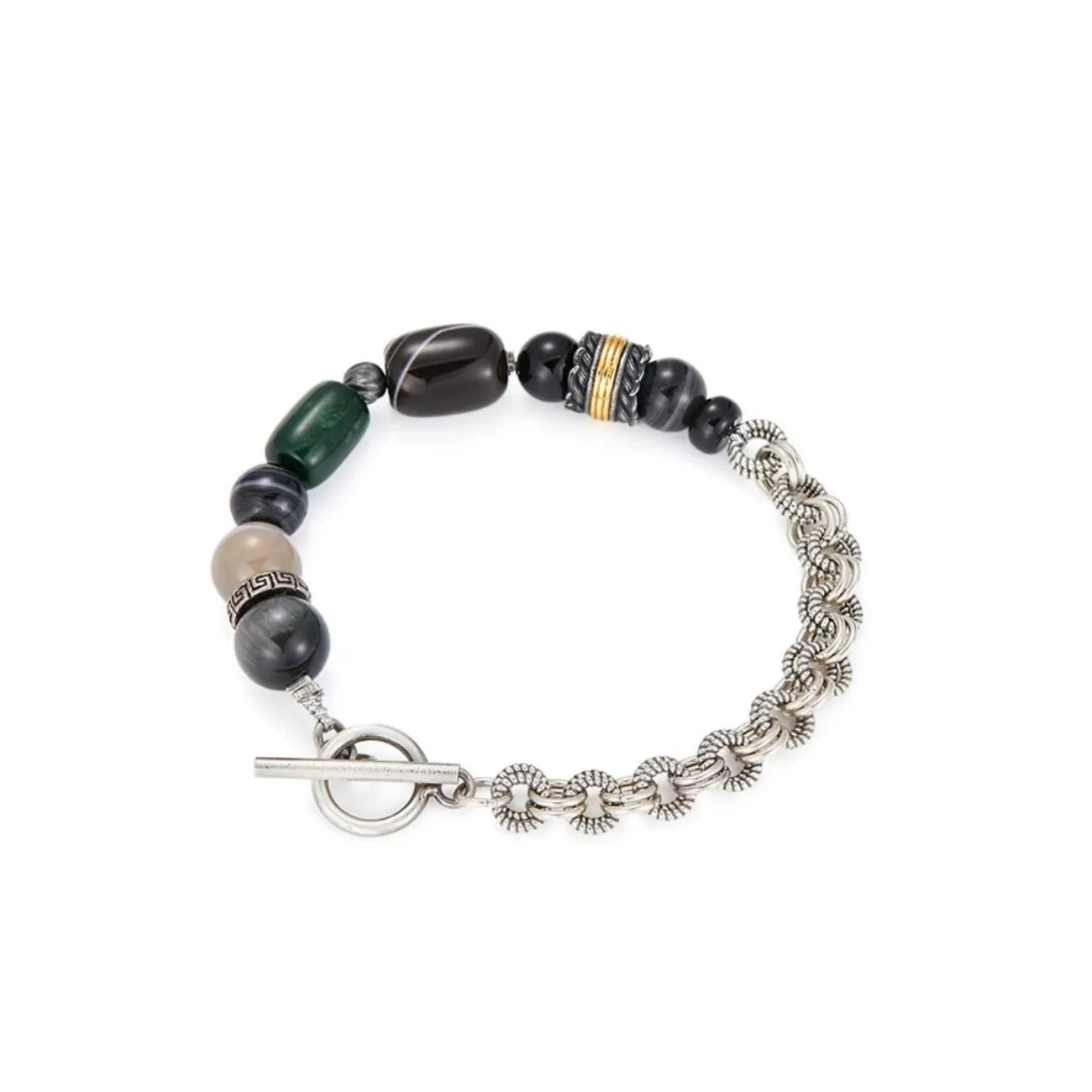 Top-down flatlay showing the asymmetrical layout: one side rugged silver chain, the other side natural green and black agate beads