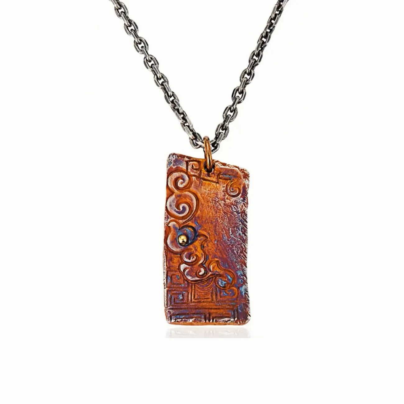 Front view of the serenity necklace showing the rectangular pendant with auspicious cloud relief and a small golden bead
