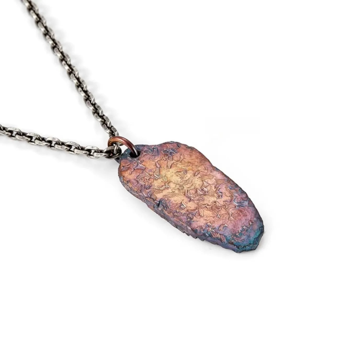 Back view of the Bagua necklace pendant, showing the rugged, hammered silver texture without the symbol