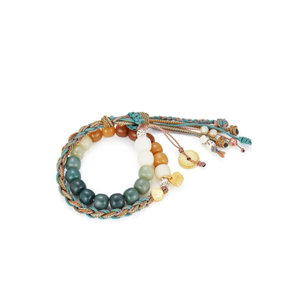 Side profile showing the transition from white bodhi seeds to carnelian beads, accented with a teal woven cord