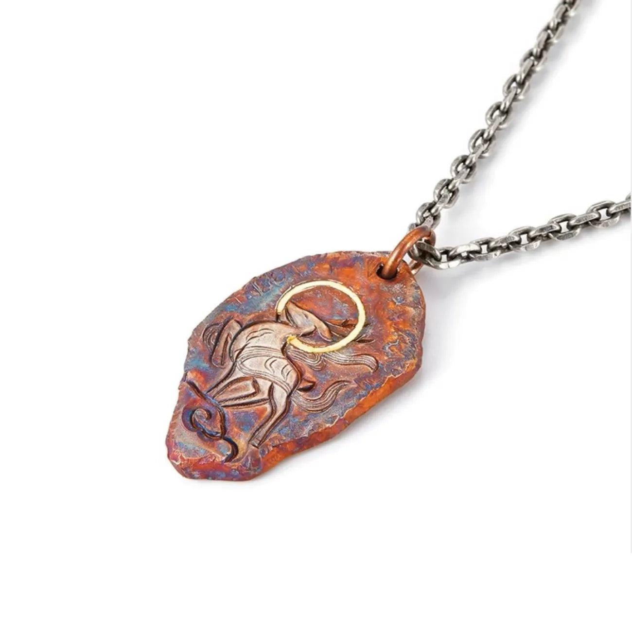 Angled shot of the rustic bronze stag pendant attached to a silver chain