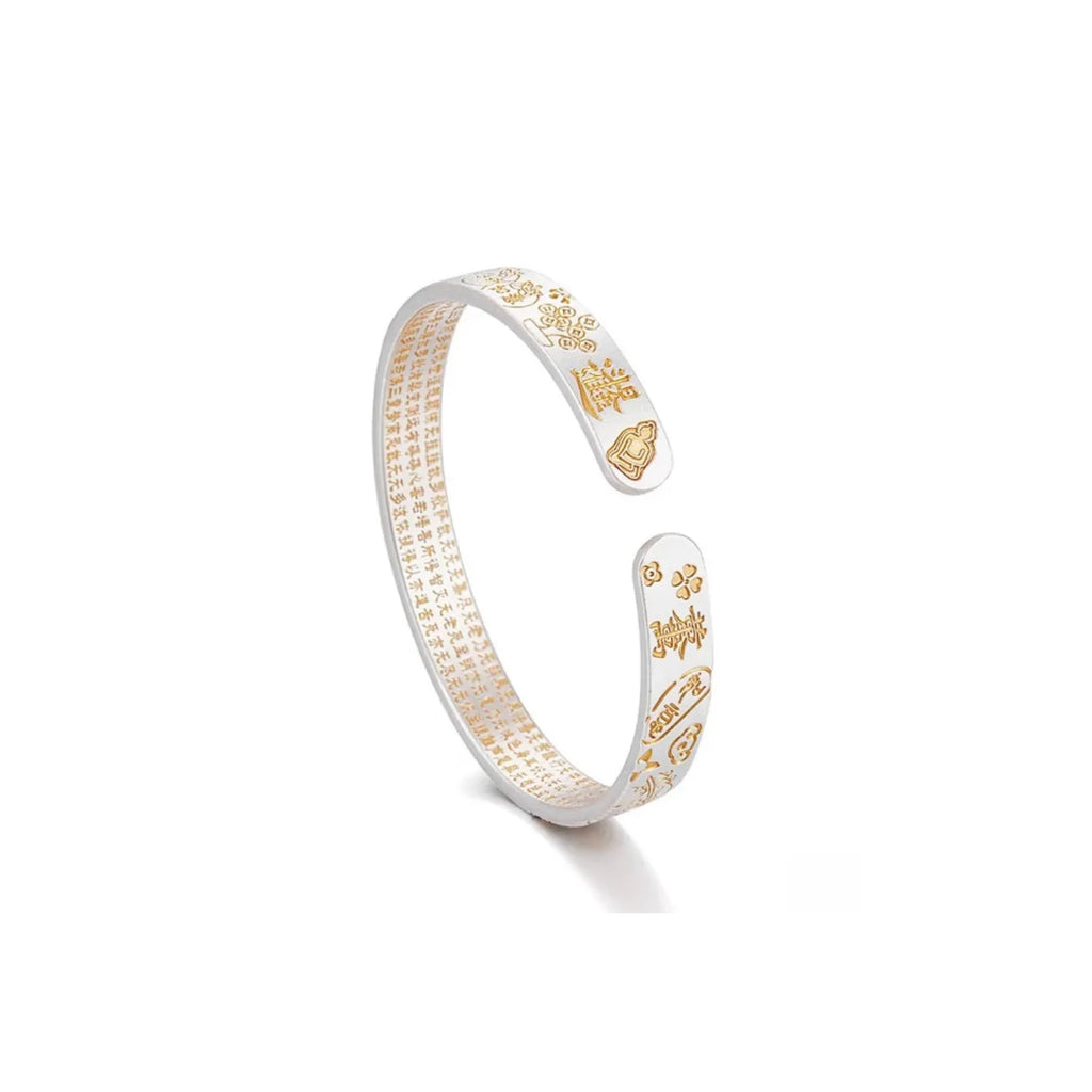 Back view of the open cuff design, highlighting the spiritual scripture engraving inside and lotus symbols outside