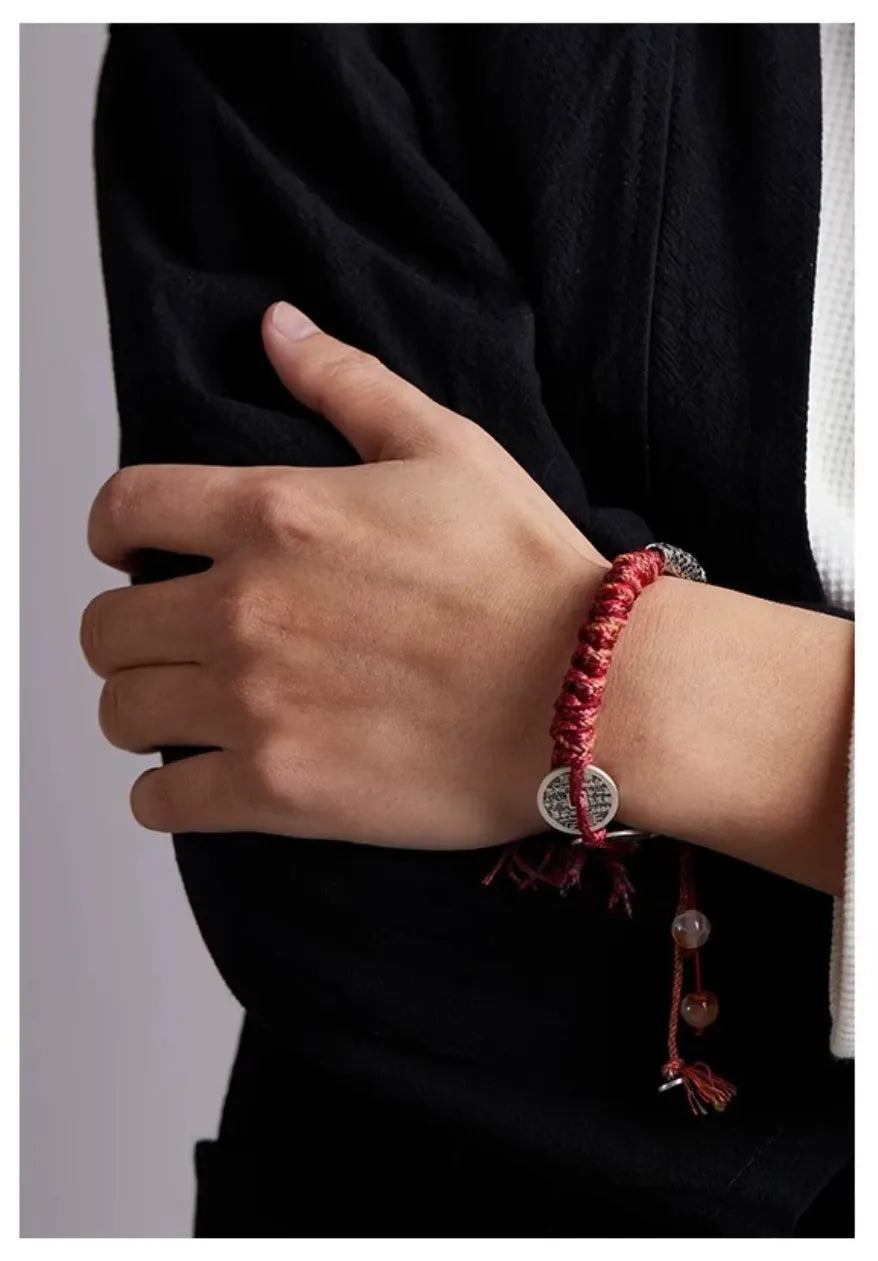 Close-up on the arm showing the three coins, symbolizing wealth and prosperity for the wearer