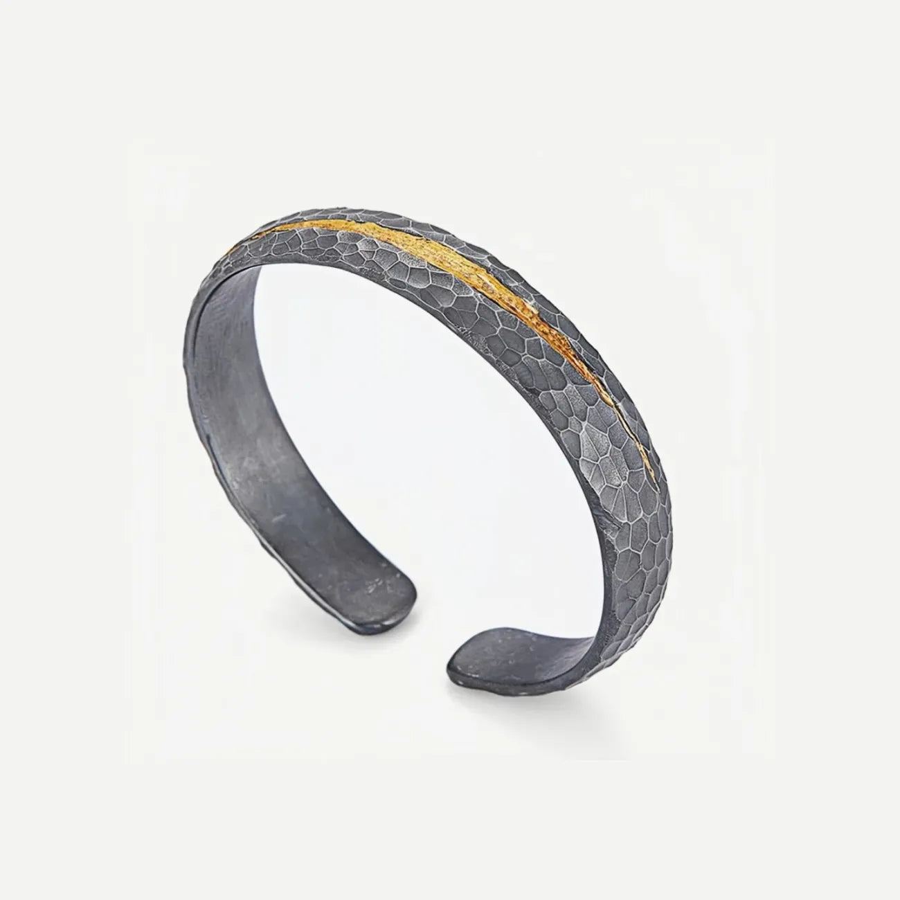 Angled top view revealing the inner silver surface and the rugged outer texture with a streak of 24k gold fusion