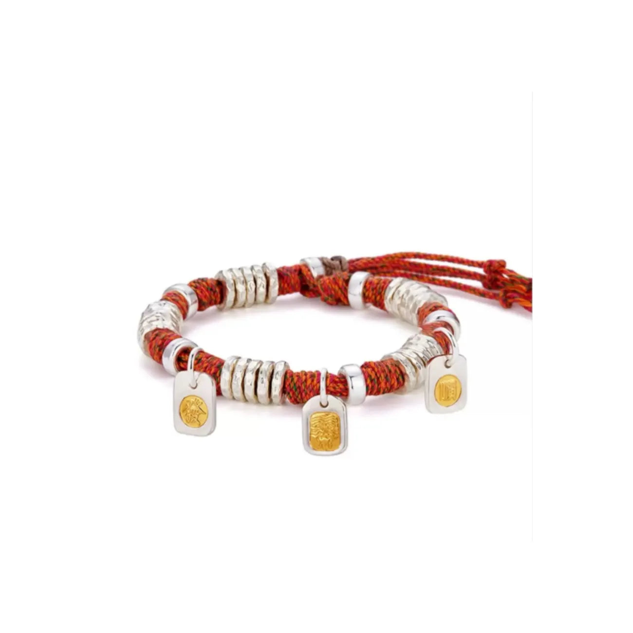 Front view of the red braided bracelet featuring three gold-inlaid silver charms: a guardian beast, an ancient coin, and a luck symbol