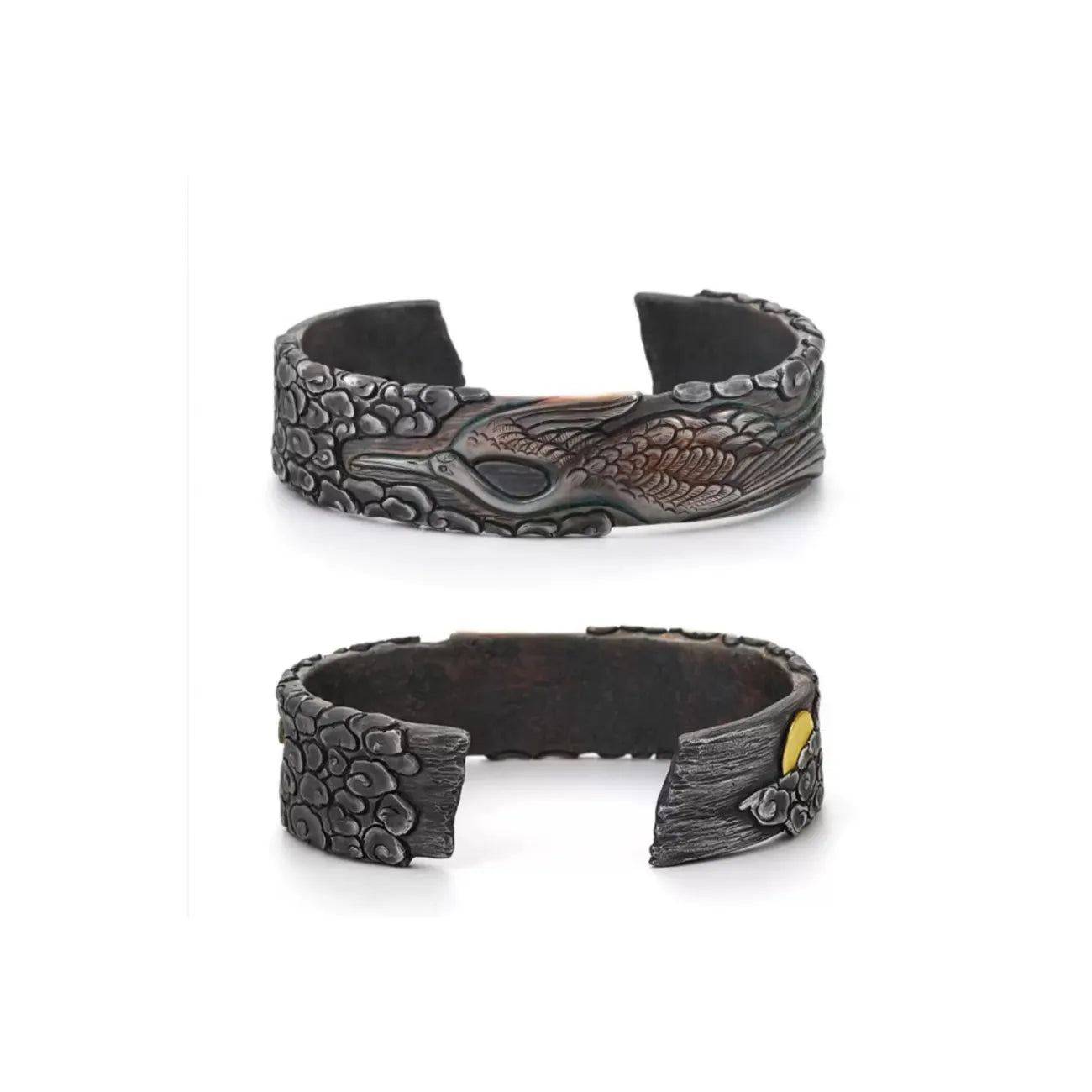 Top-down view focusing on the striking contrast of a small golden sun/moon accent against the dark, stormy cloud patterns