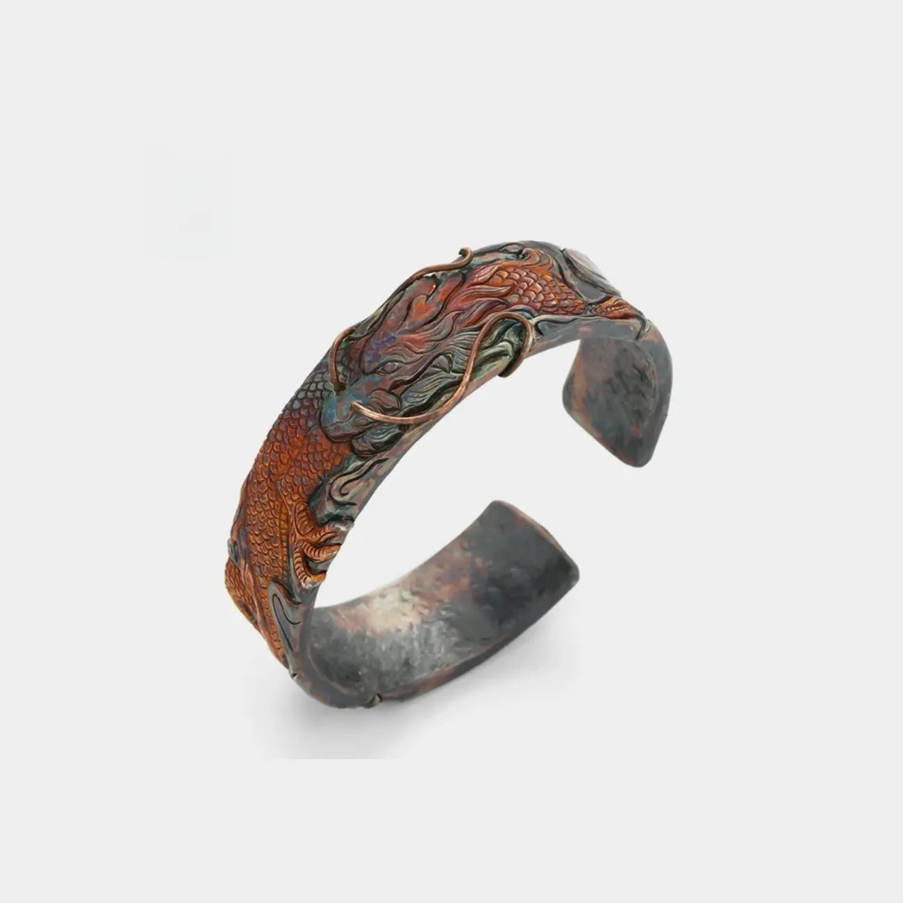 Close-up top view focusing on the intricate dragon scales and cloud patterns in rufous and bronze tones