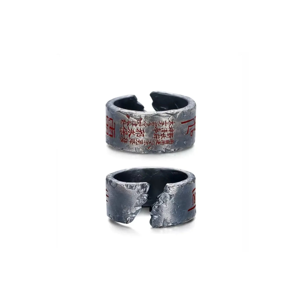 Side profile showing the rugged hand-carved texture of the silver Taoism amulet ring