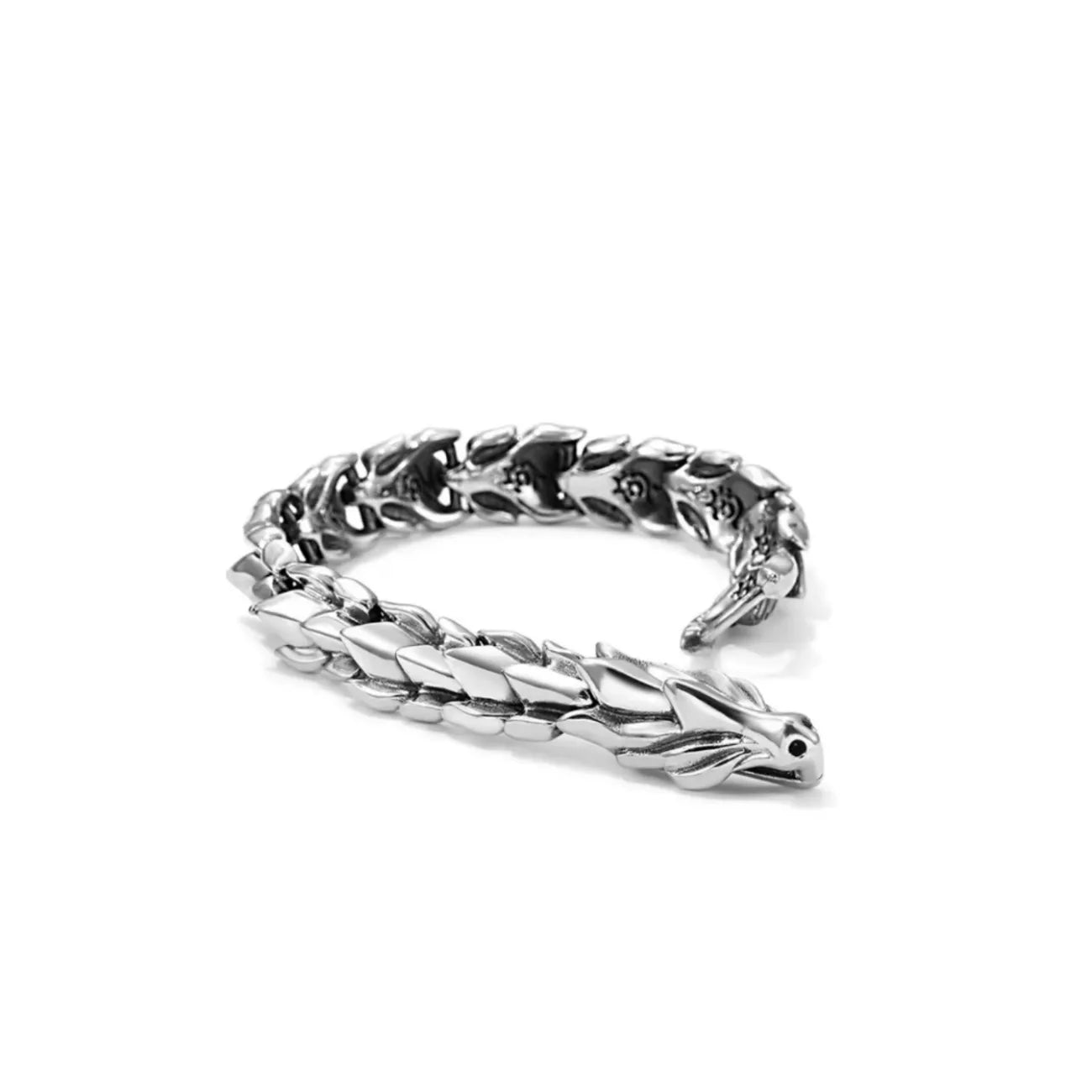 Side profile showing the articulated spine structure and the oxidized finish for depth