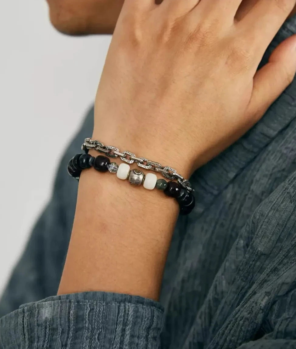 A stylish close-up showing the bracelet's texture against indigo fabric, perfect for men who appreciate detailed craftsmanship