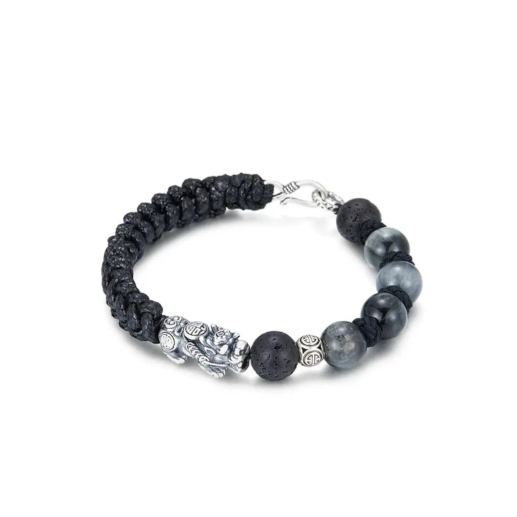 Side profile showing the transition from porous lava stone beads to the hand-woven black cotton cord