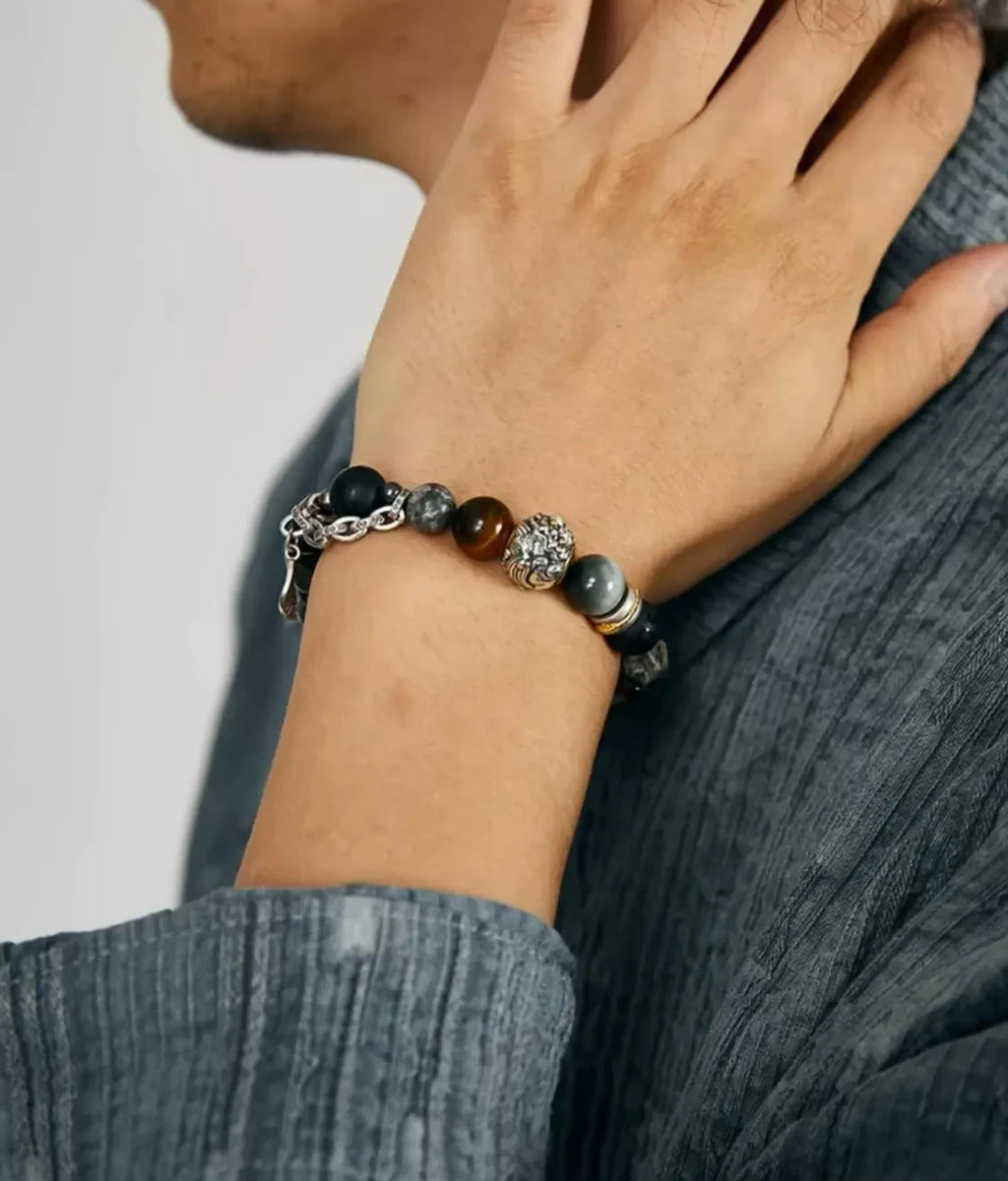A man wearing the Guardian bracelet, showcasing its sophisticated look suitable for daily wear and spiritual grounding
