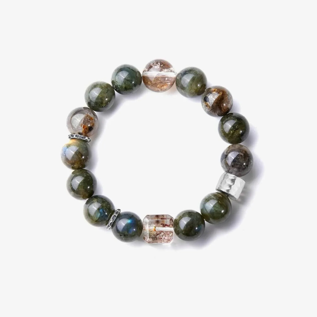 Top-down view displaying the translucency of the rutilated quartz and the mysterious sheen of the dark beads