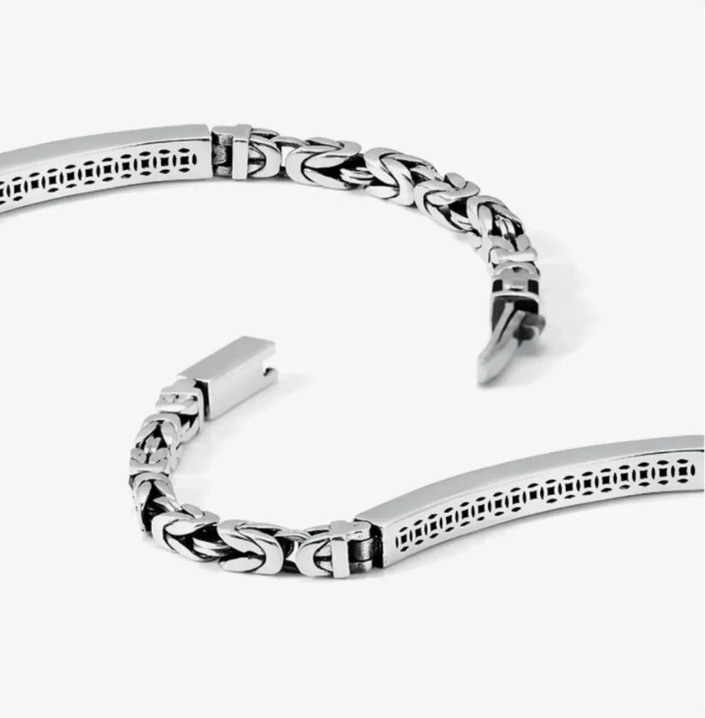 Top-down view emphasizing the clean lines and the contrast between the smooth bar and textured chain