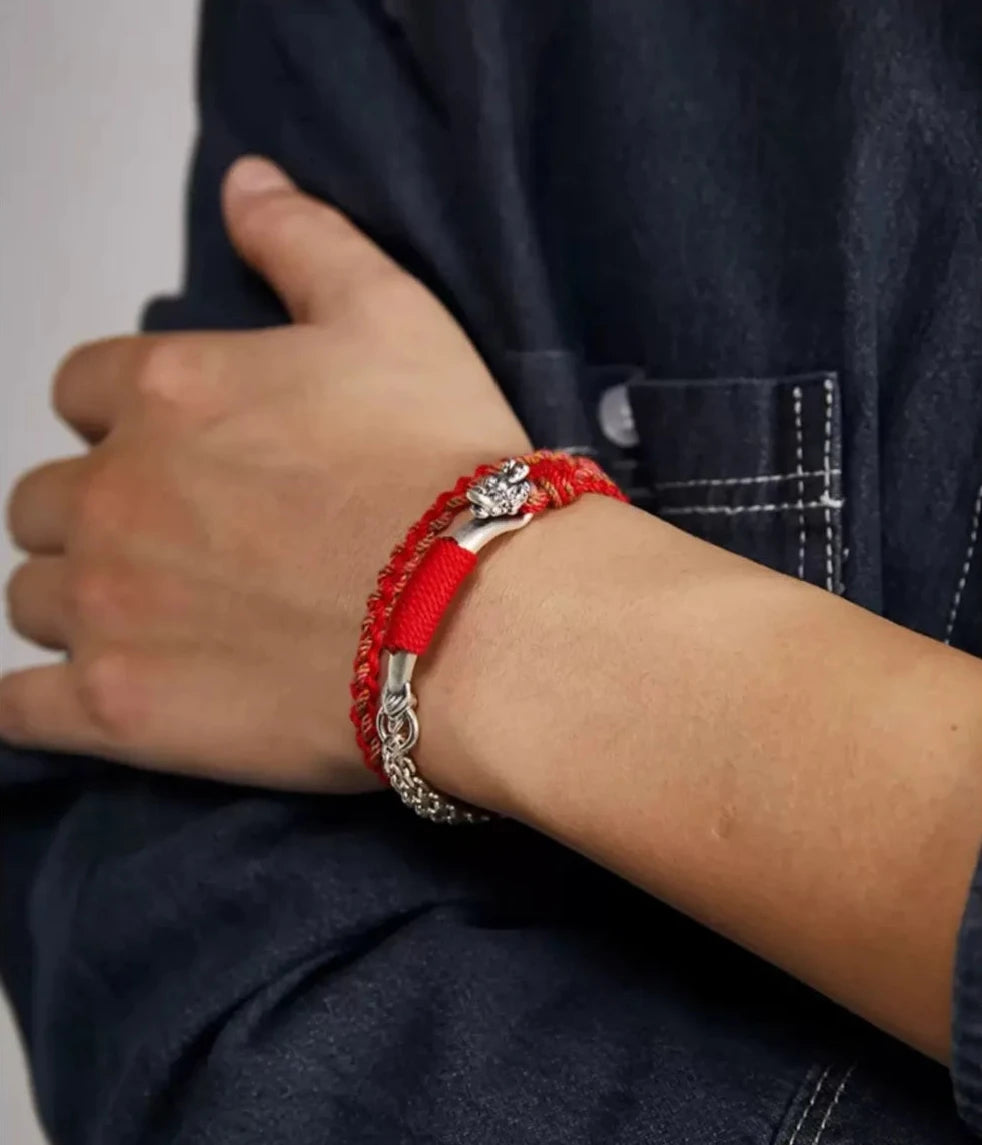 A relaxed pose showing the bracelet as a stylish everyday talisman, perfect for the Year of the Snake or Dragon