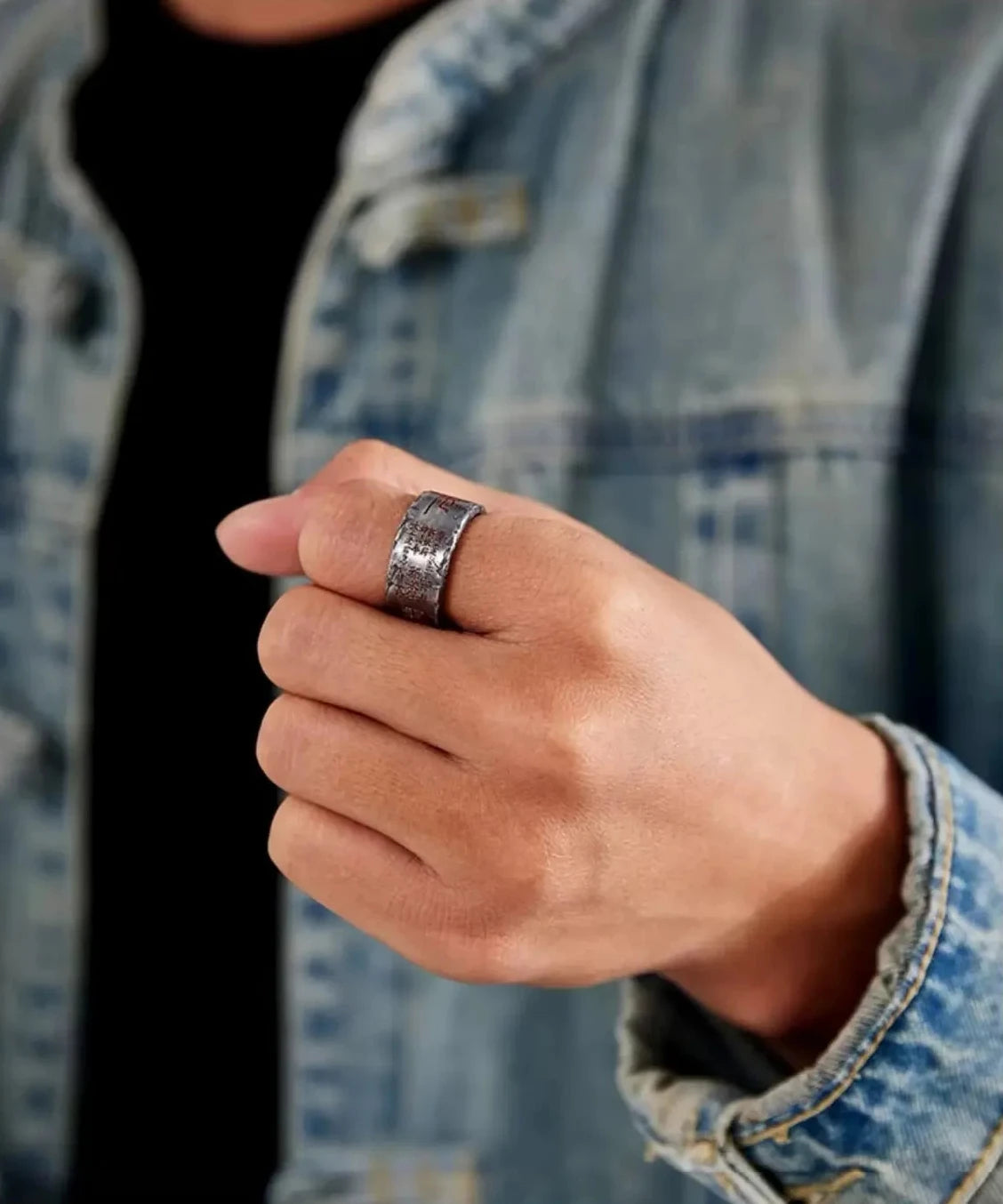Model wearing the silver Taoism amulet ring on the thumb to show scale and masculine style