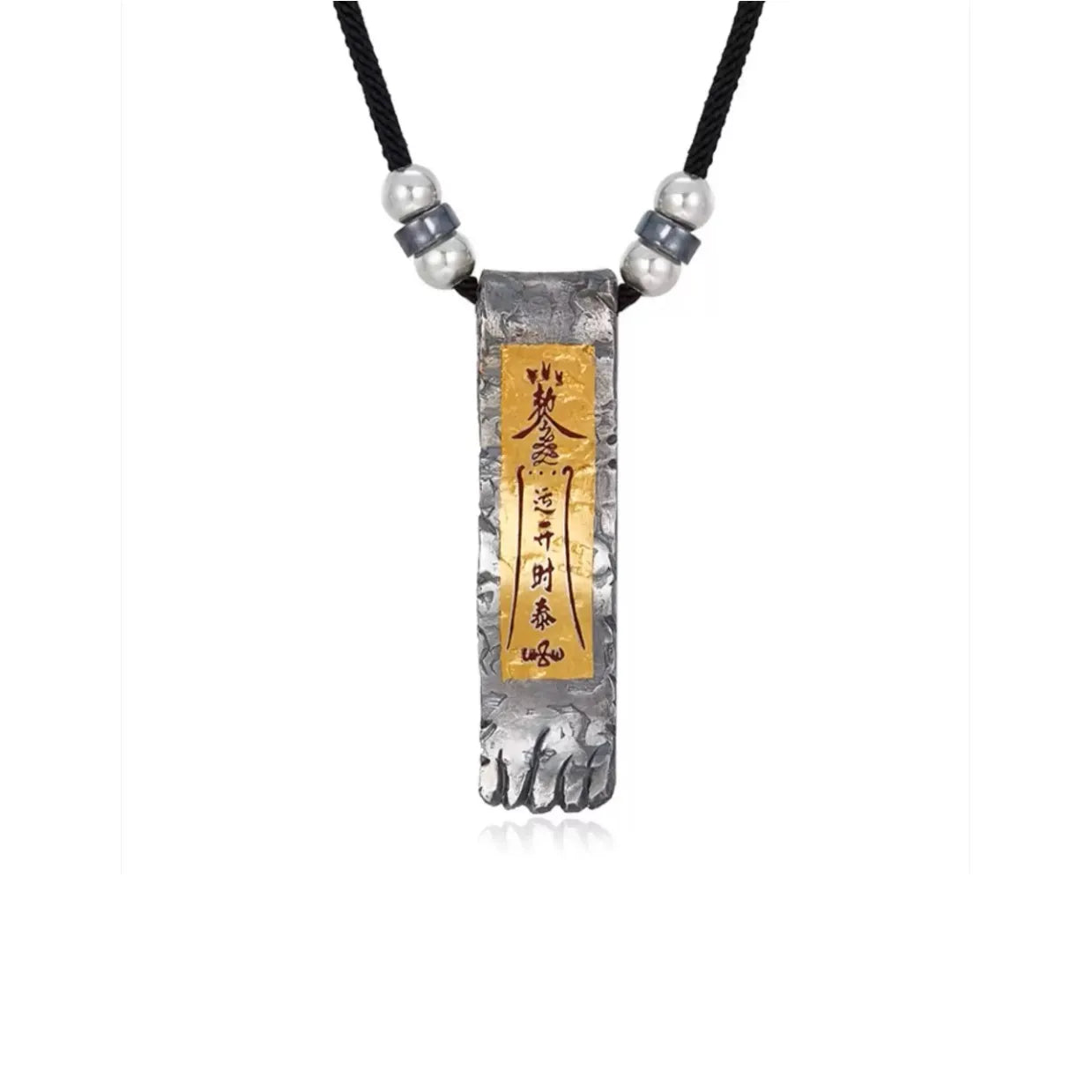 Front view of silver Taoist pendant featuring a gold inlay rectangle with calligraphy