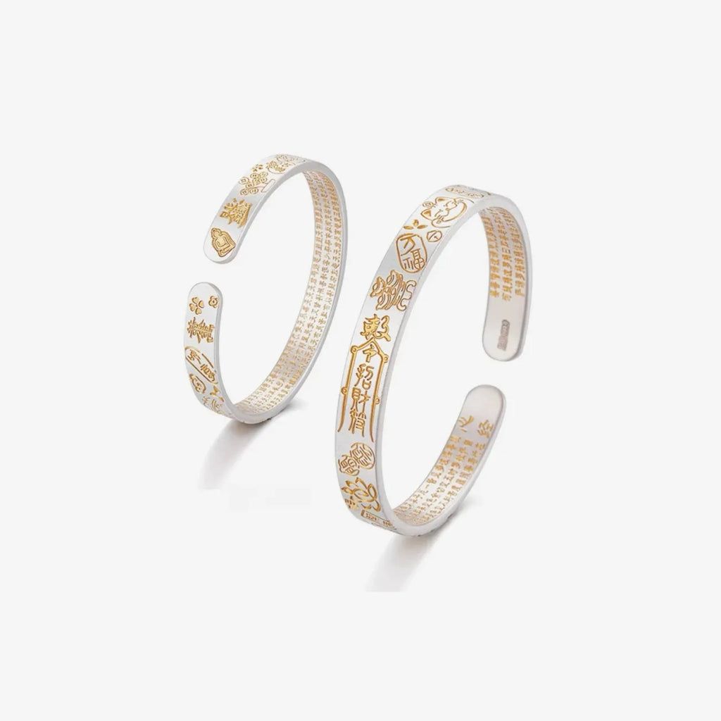 Top view displaying the intricate craftsmanship of the Fortune Bangle, emphasizing the contrast between matte silver and polished gold accents