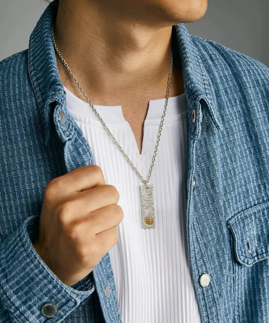 Model wearing the Golden Bliss silver necklace with a denim shirt, showcasing the casual style