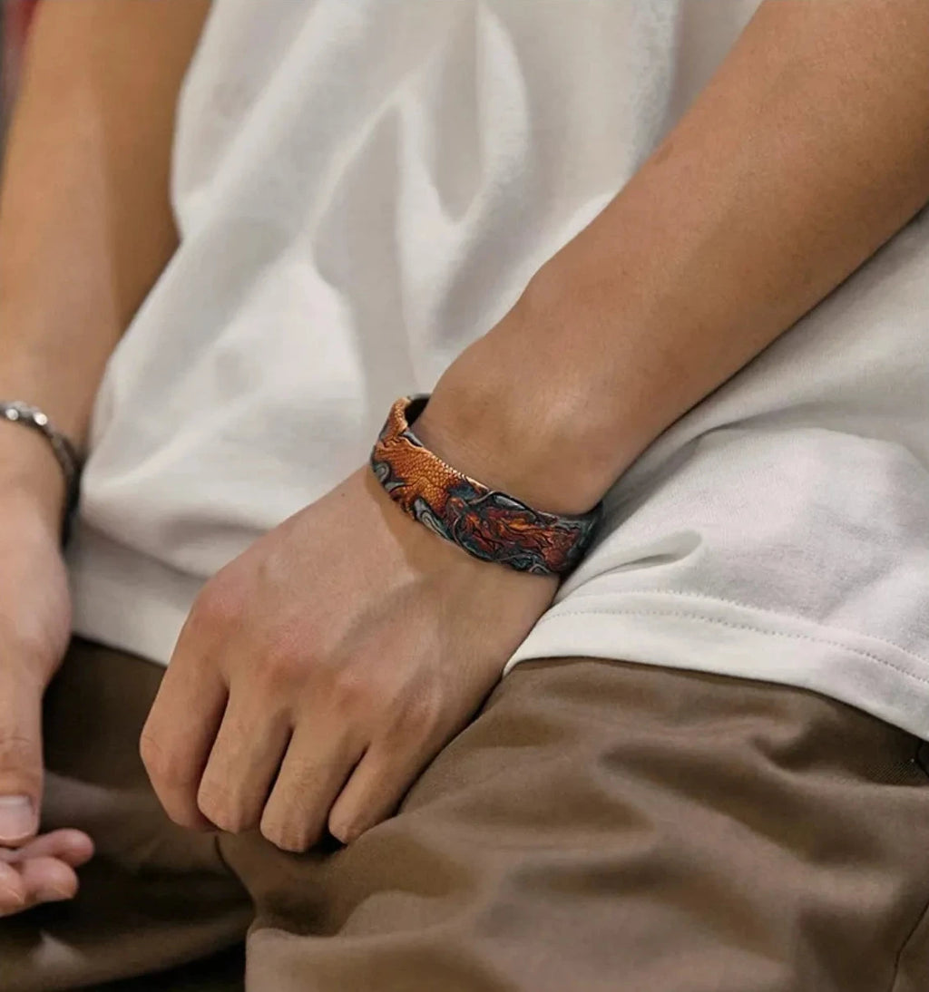 Close-up of the dragon bangle worn with a simple white t-shirt, highlighting its versatility as a daily accessory