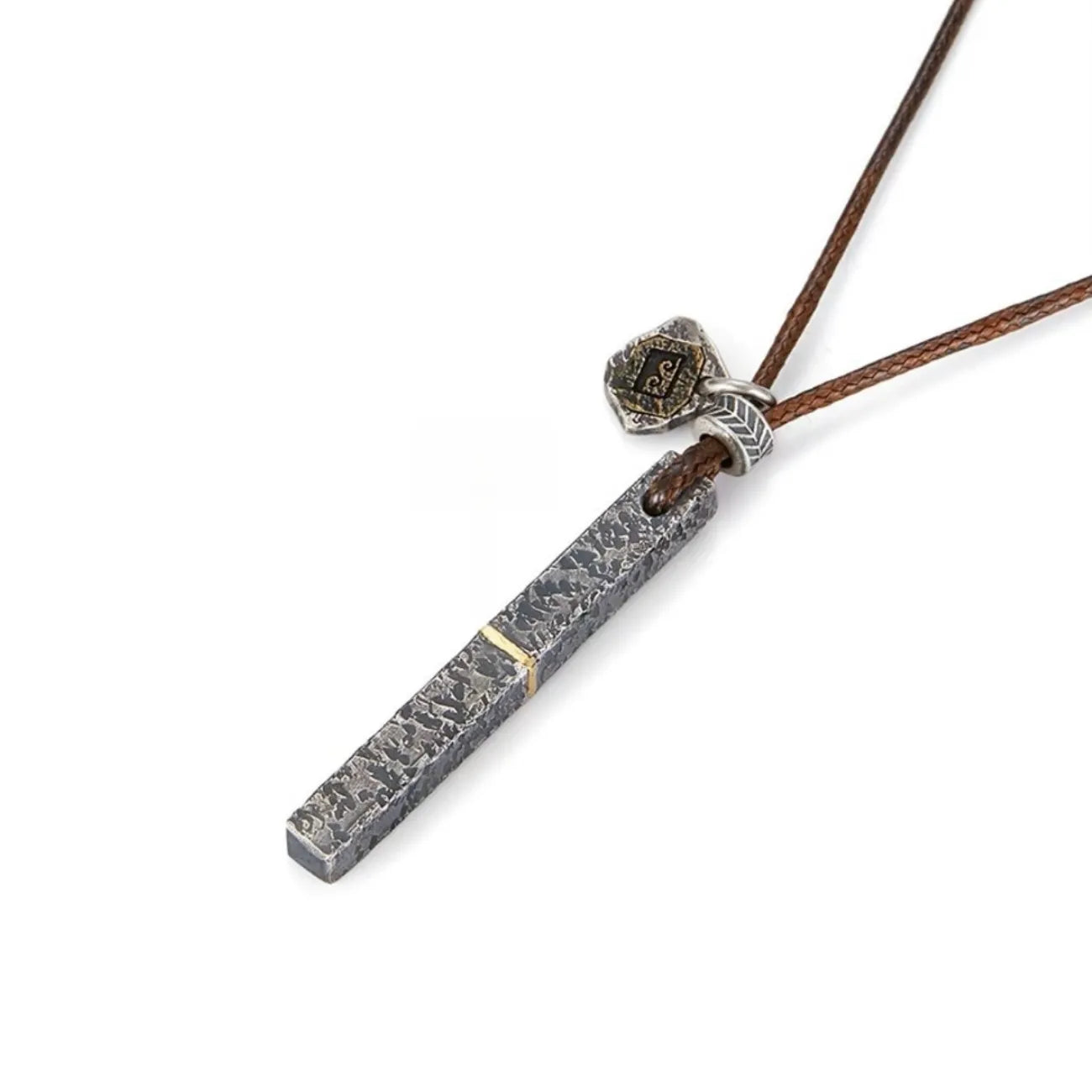 Side view of the silver bar pendant showing the thickness and the attached vintage bronze tag