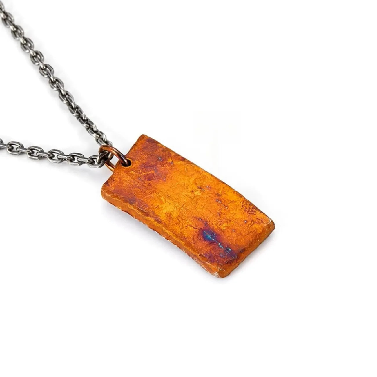 Back view of the handcrafted necklace showing the unique rugged finish and texture of the material