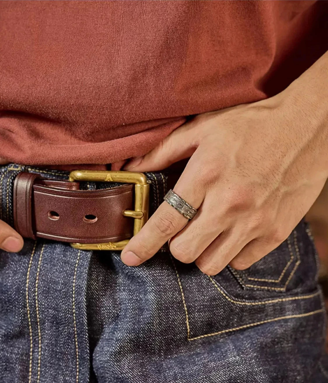 Lifestyle shot of the Shift Ring worn with a denim outfit and leather belt, perfect for everyday casual carry