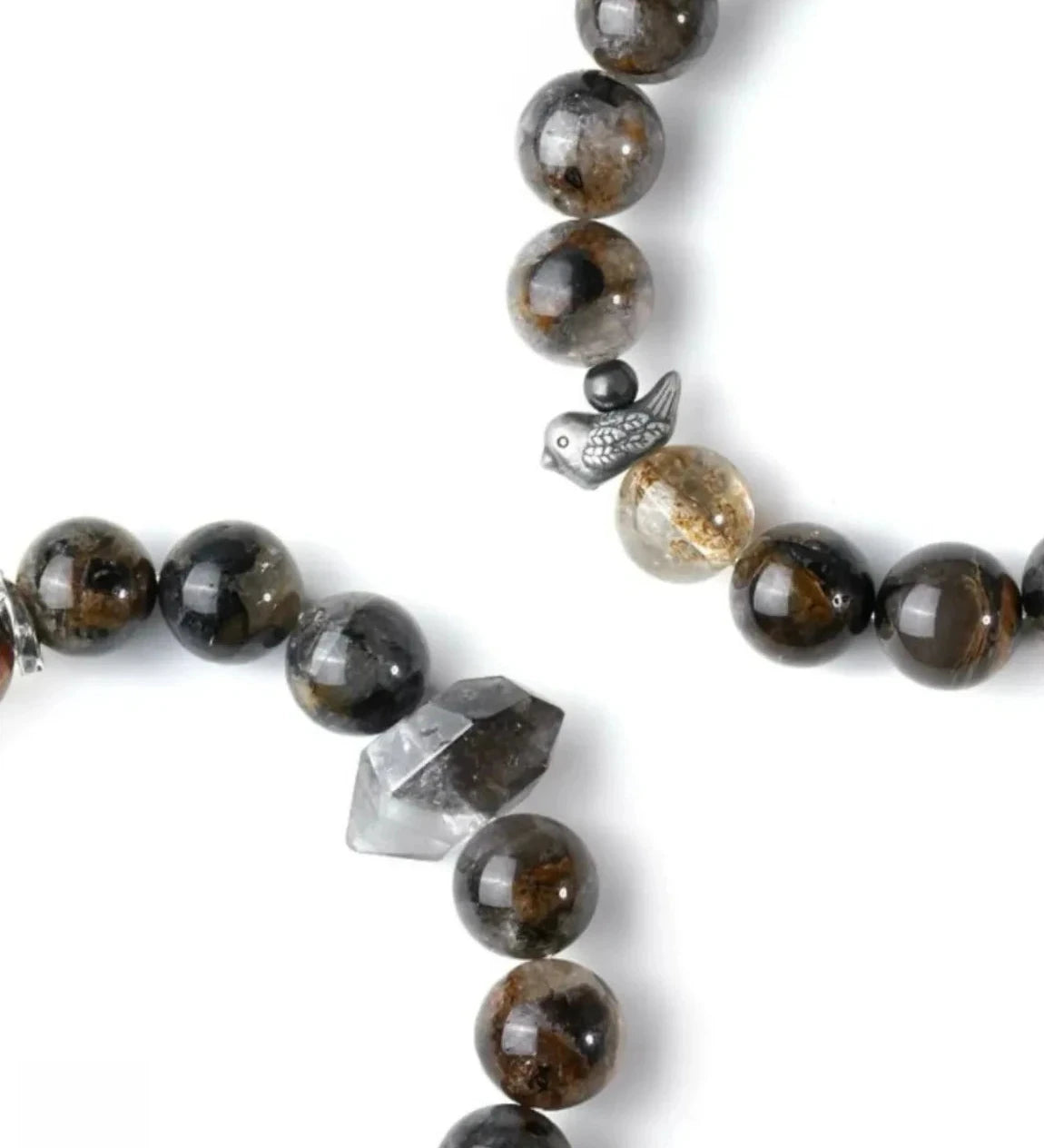 Top-down view highlighting the raw, unpolished crystal point that serves as the bracelet's focal energy center