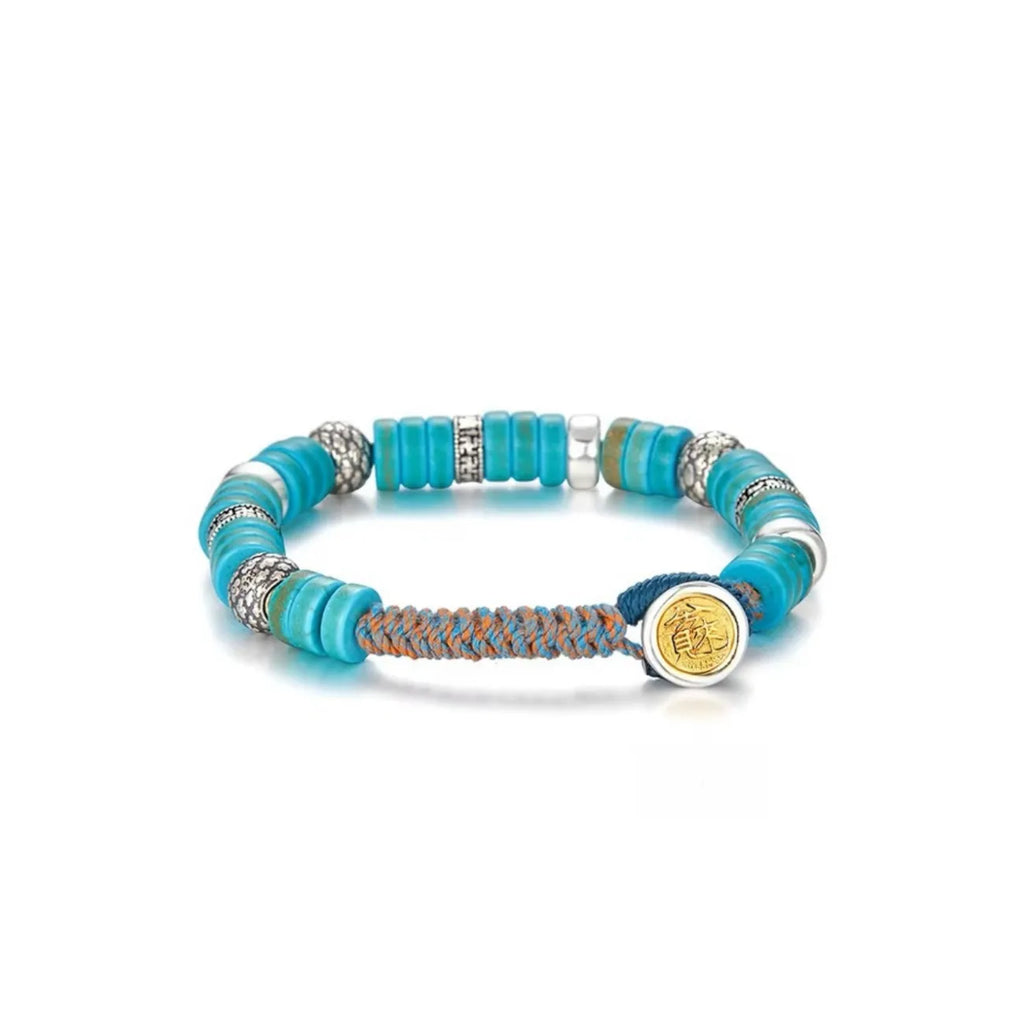 Front view of the Blessing Bracelet, featuring vibrant turquoise heishi disc beads interspersed with textured silver spacers