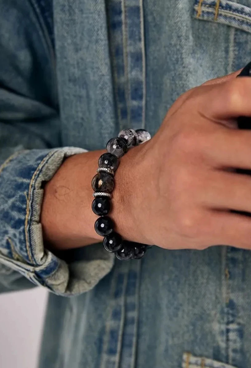 A candid shot showing the bracelet as a daily essential accessory for the modern urban man