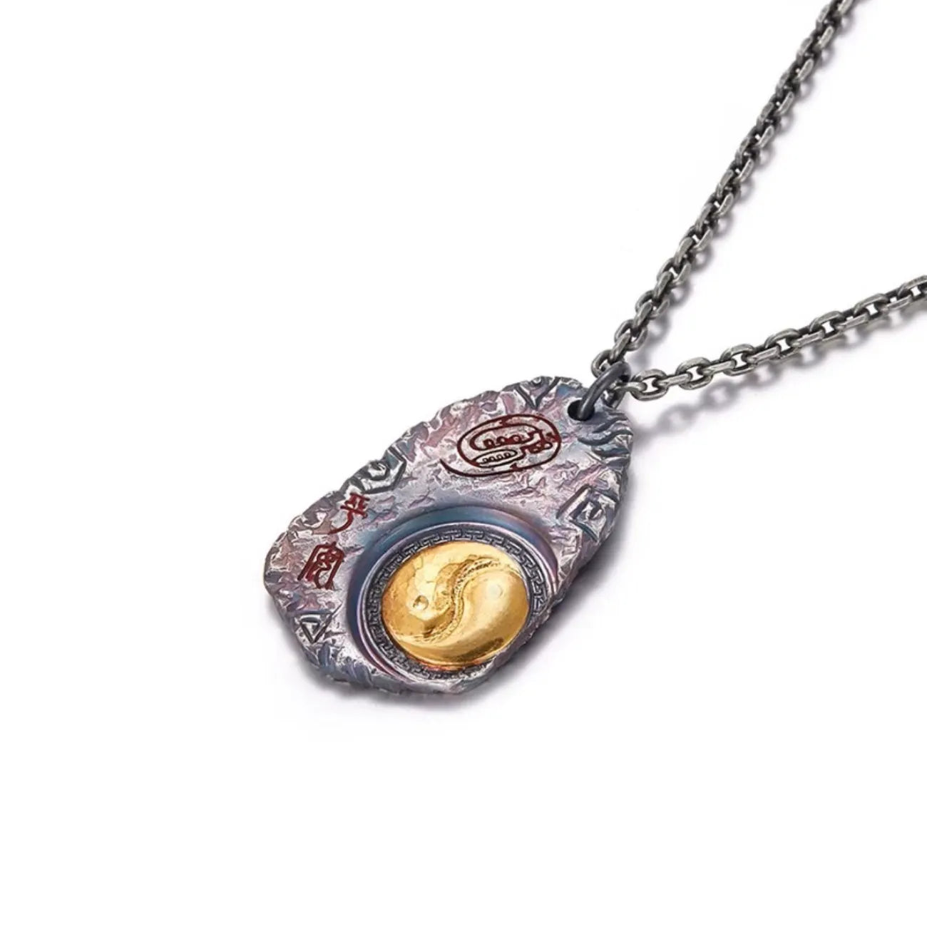 Angled shot of the Taichi necklace, highlighting the heat-treated vintage finish and gold accents
