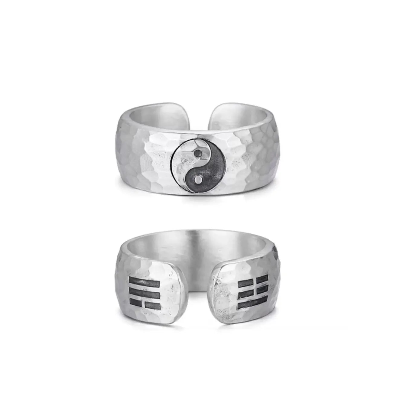 Front view of the Bagua Ring featuring a central Yin Yang symbol engraved on a handcrafted hammered silver band