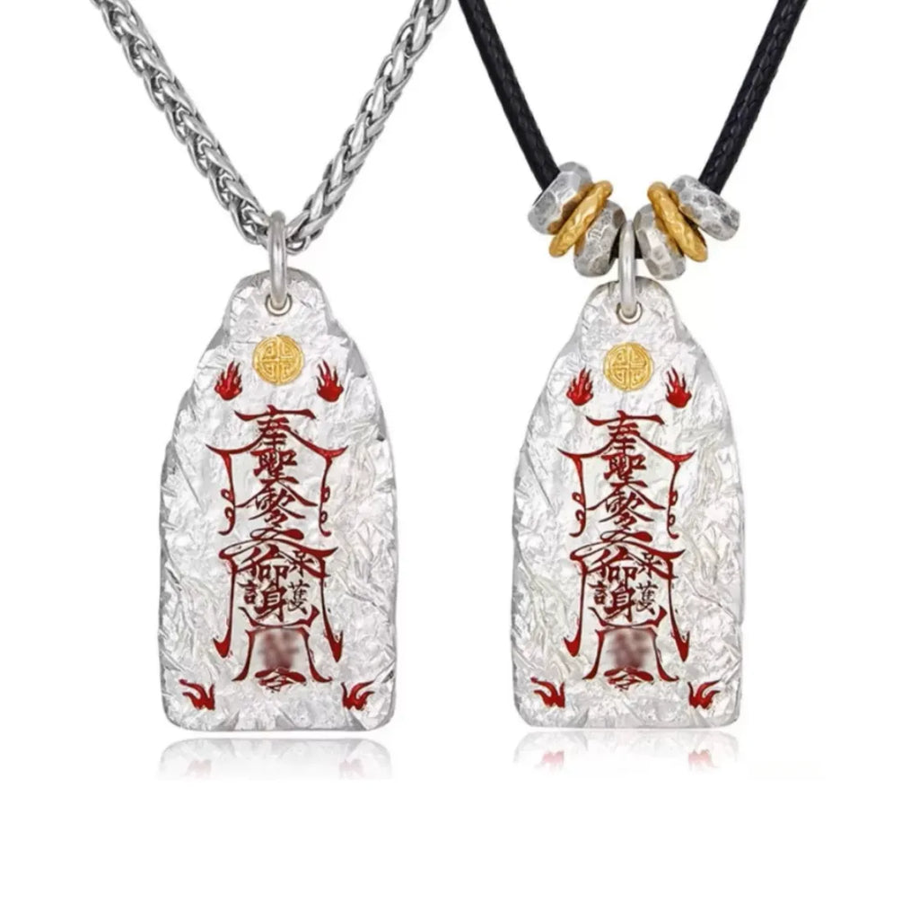 Comparison of two Taoist talisman necklaces: one with a silver chain and one with a black leather cord and golden beads