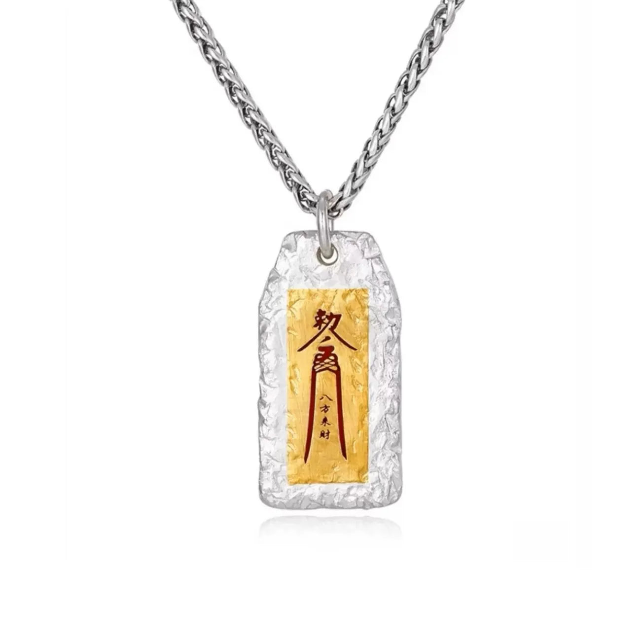 Front view of a silver tag pendant featuring a gold center with a Cinnabar red Taoist talisman for attracting wealth
