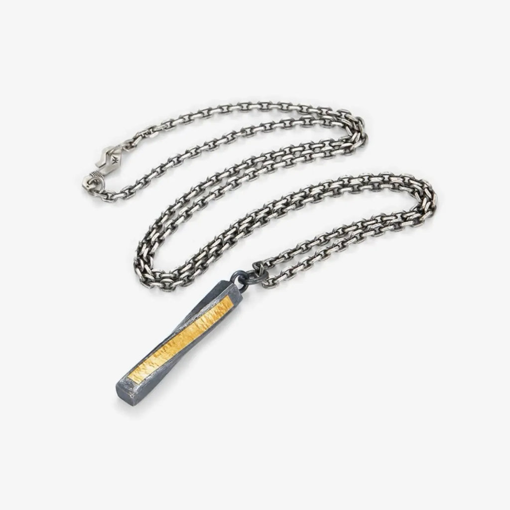 Flat lay of the necklace with a sturdy silver chain, showcasing the complete design and craftsmanship