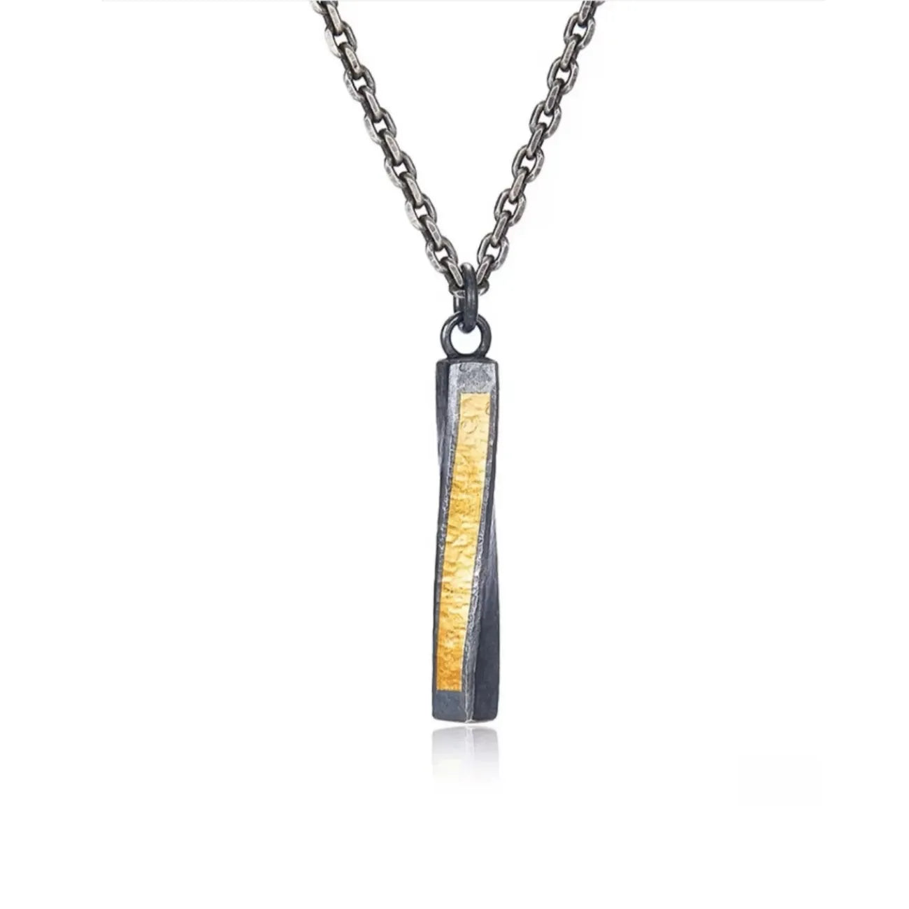 Front view of the twisted rectangular bar pendant featuring a striking gold foil inlay against oxidized silver