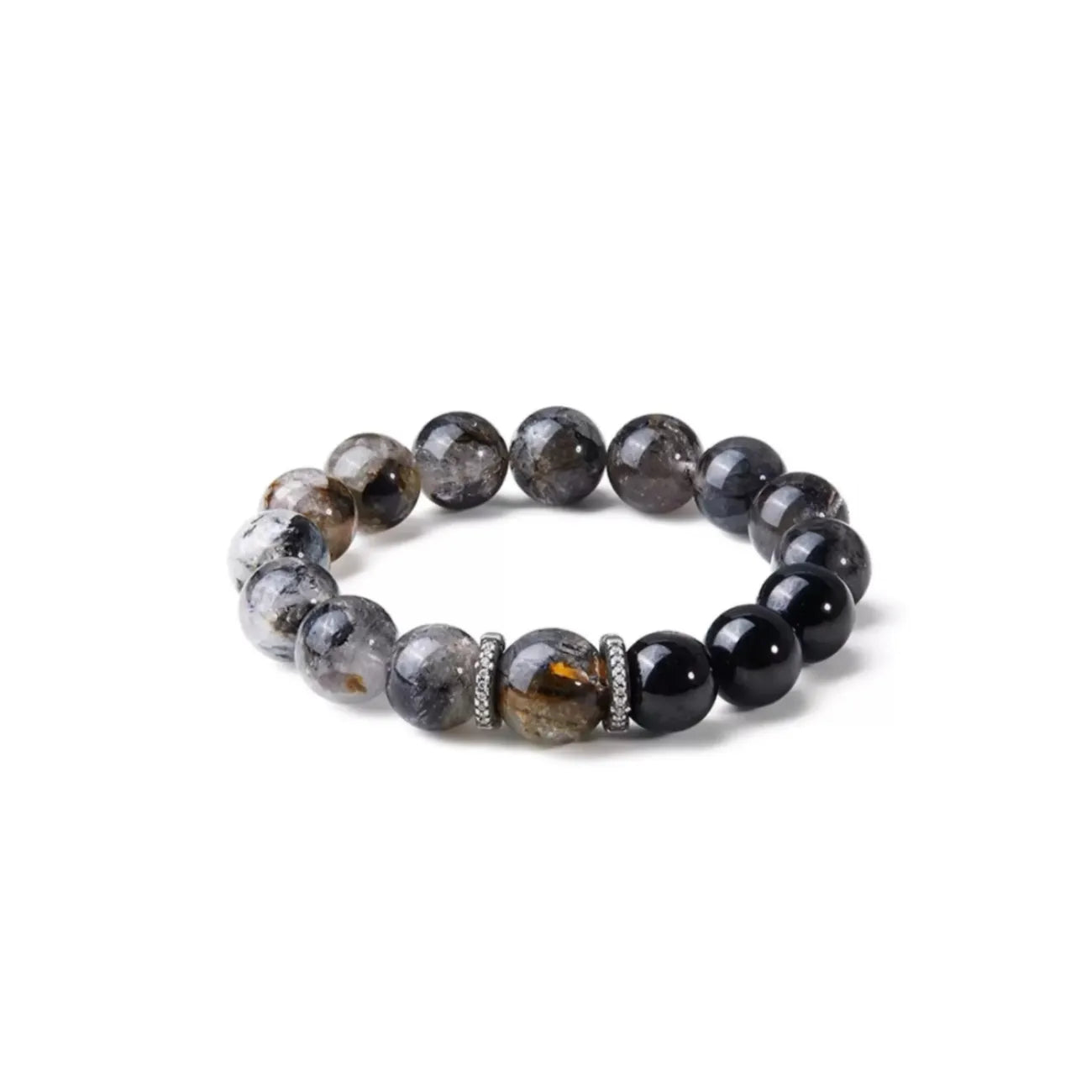 Front view of the Vanquisher bracelet featuring clear quartz beads with black tourmaline needles and a central brown accent stone
