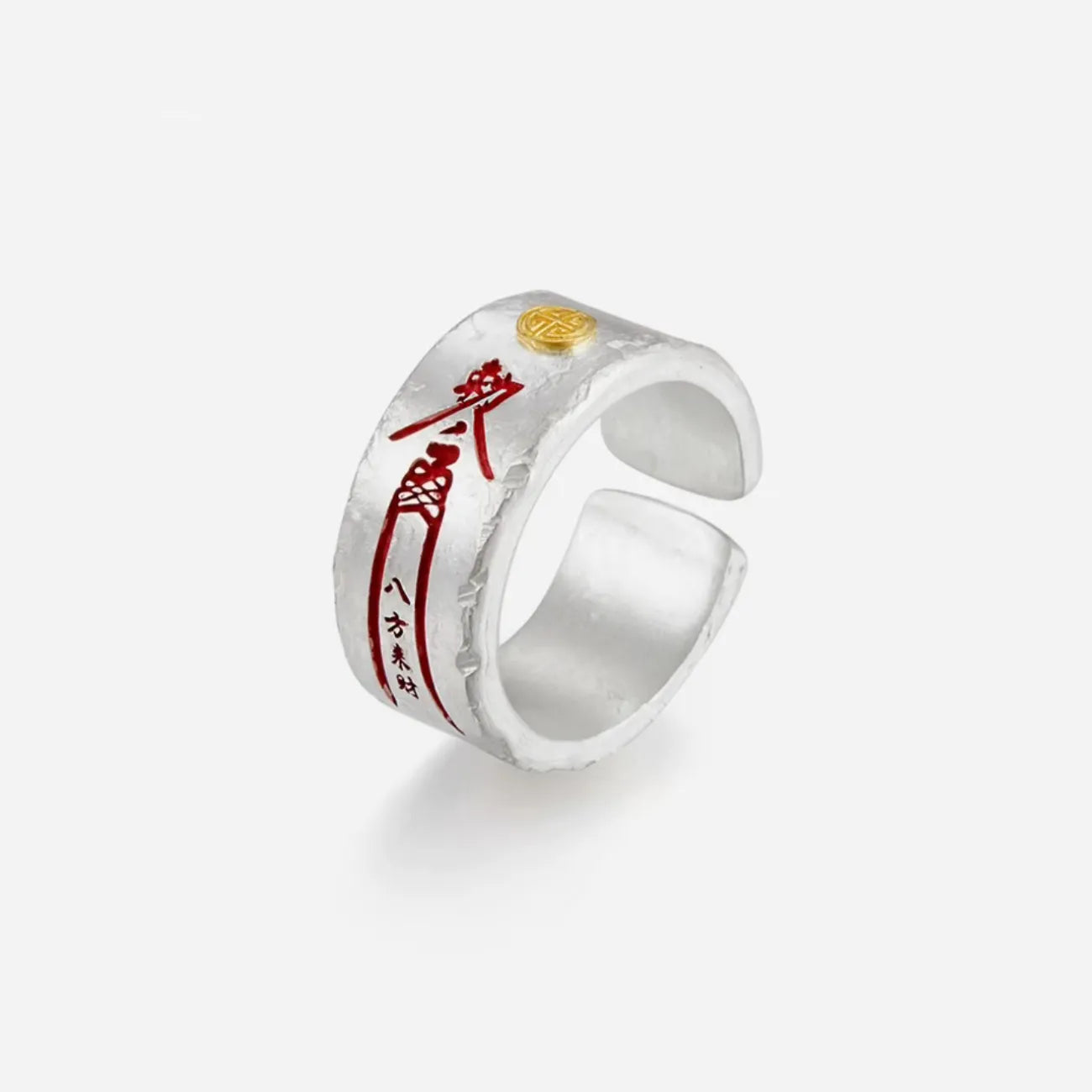 Top-down detail shot focusing on the engraved cinnabar characters on the matte silver surface