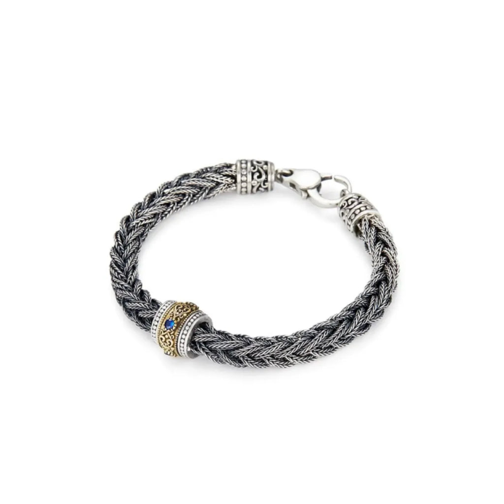 Side profile showing the intricate filigree details on the bronze and silver barrel bead