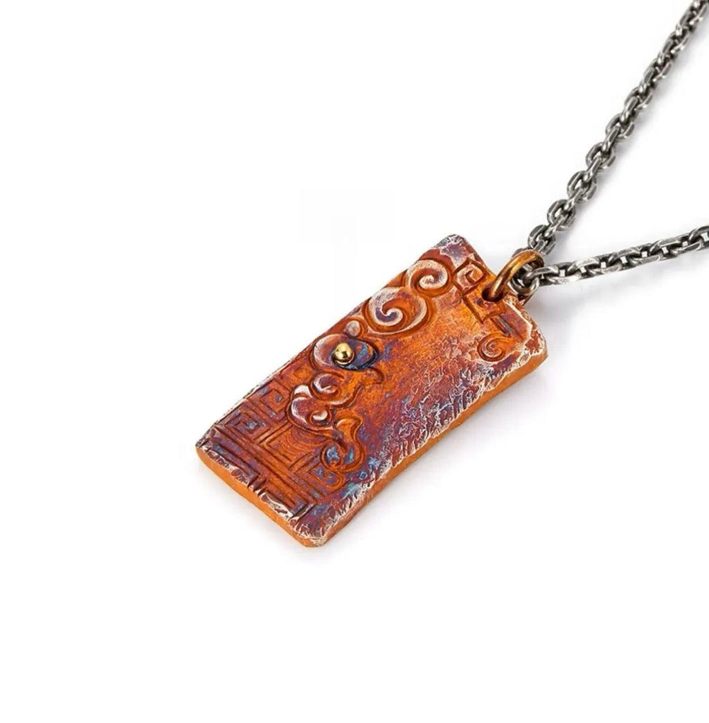 Angled side view of the vintage-style pendant highlighting its thickness and the rugged rufous texture